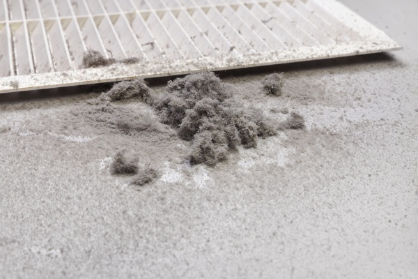 Dust and debris accumulating in an air duct during cleaning service in New Jersey