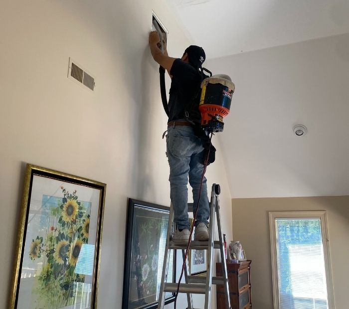 Certified HVAC cleaners perform air duct maintenance in New Jersey home to enhance indoor air quality