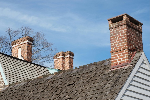 Chimneys on historic homes in New Jersey under clear blue sky Chimneys on historic homes in New Jersey under clear blue sky