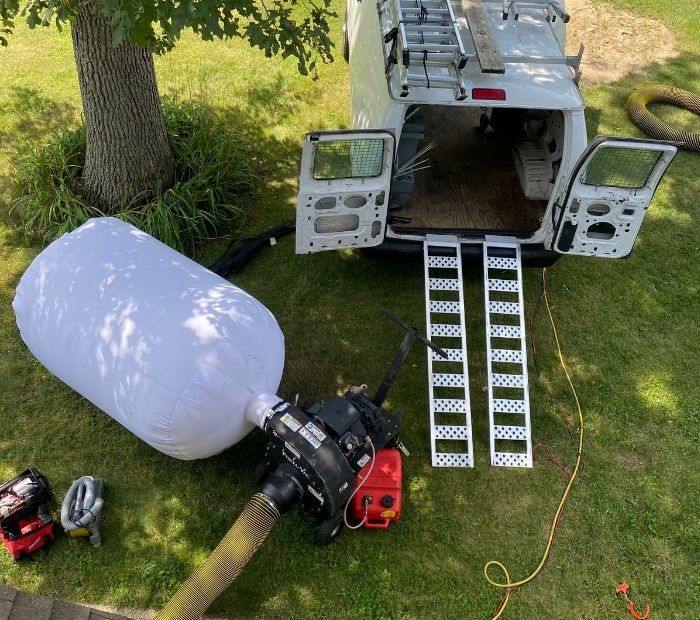 Professional HVAC system cleaning service in New Jersey with specialized equipment in action at a residential location