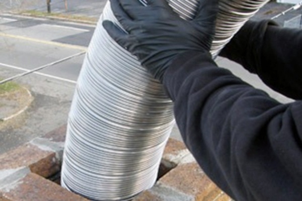 Chimney liner installation by local professionals in New Jersey on a clear day Chimney liner installation by local professionals in New Jersey on a clear day