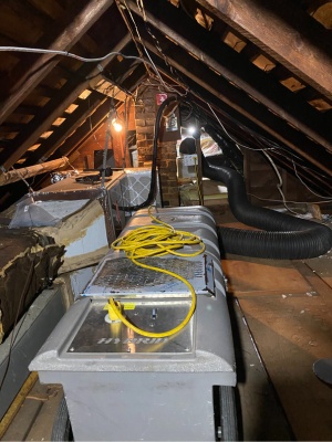 Energy-saving booster fan installation in an attic in New Jersey to improve airflow and efficiency Energy-saving booster fan installation in an attic in New Jersey to improve airflow and efficiency