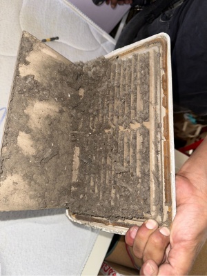 Dirty HVAC unit handled by technician in New Jersey to prevent mold growth during maintenance activities Dirty HVAC unit handled by technician in New Jersey to prevent mold growth during maintenance activities